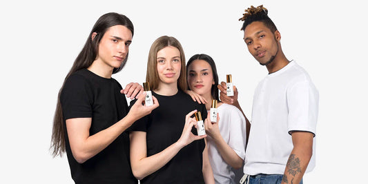 Group of four young models showing Divain Care facial care products.