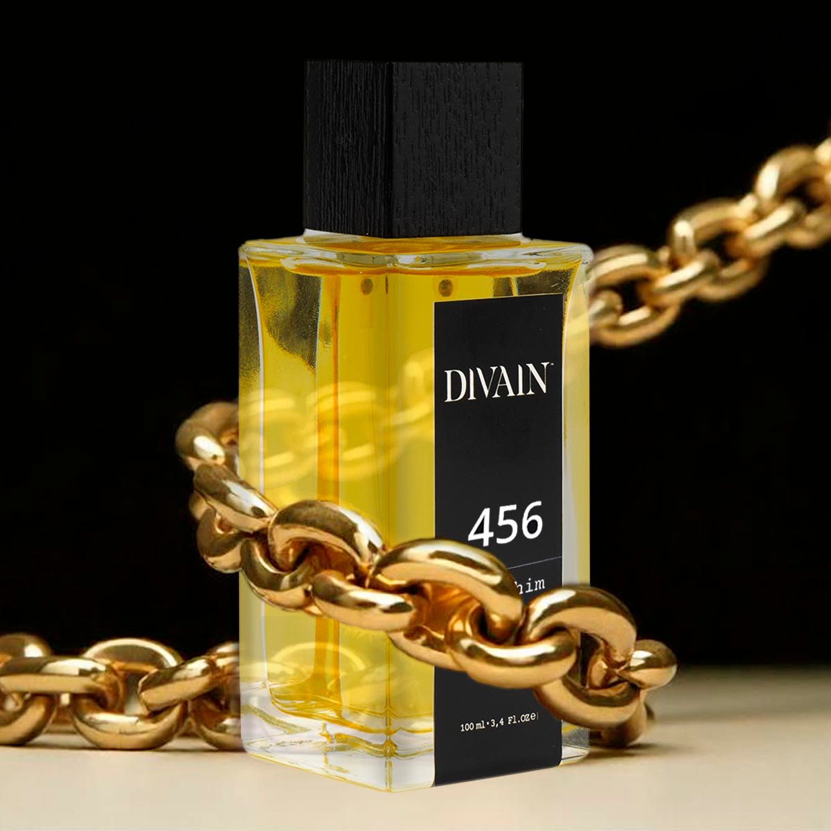 Perfume divain-456 surrounded by a gold chain giving a sense of luxury.